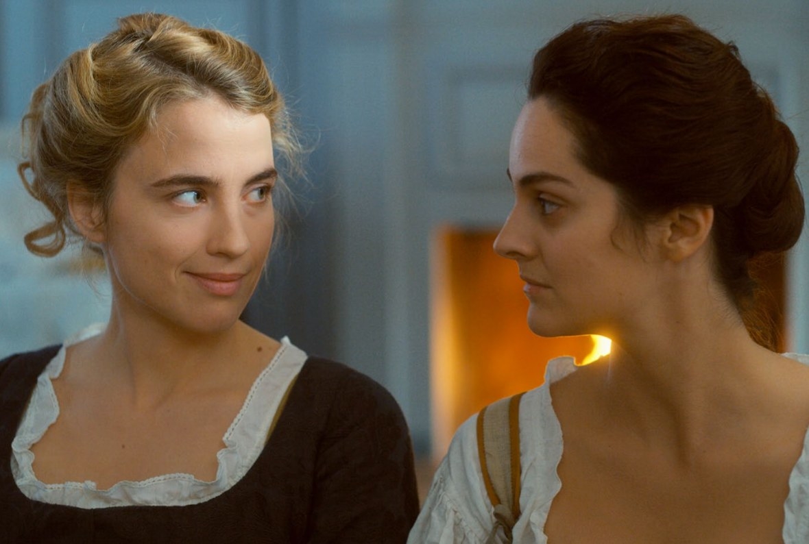 Héloïse (left) stares smirking at Marianne (right). 