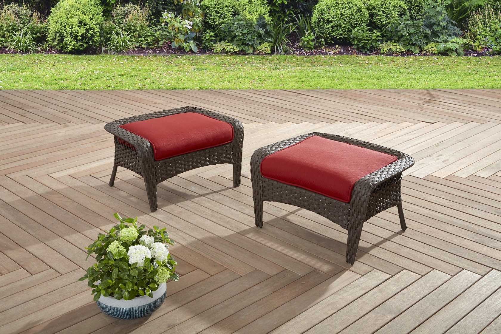 dark wicker ottomans with red cushions 