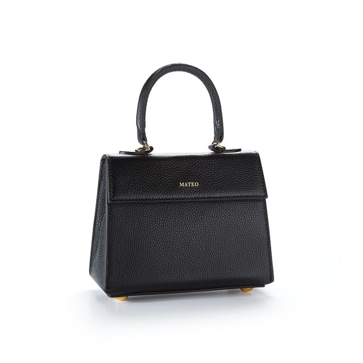 Small black leather purse with a top handle