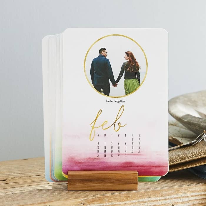 Easel calendar with a watercolor ombre background and a circle layout design for one photo, plus dates for the month