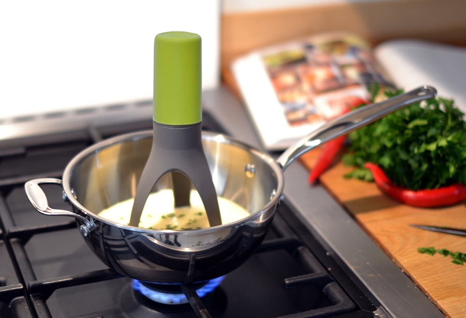 An automatic stirrer stirring eggs in a pan
