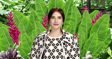 A gif of actress Emma Roberts putting her hands to her face in excitement.