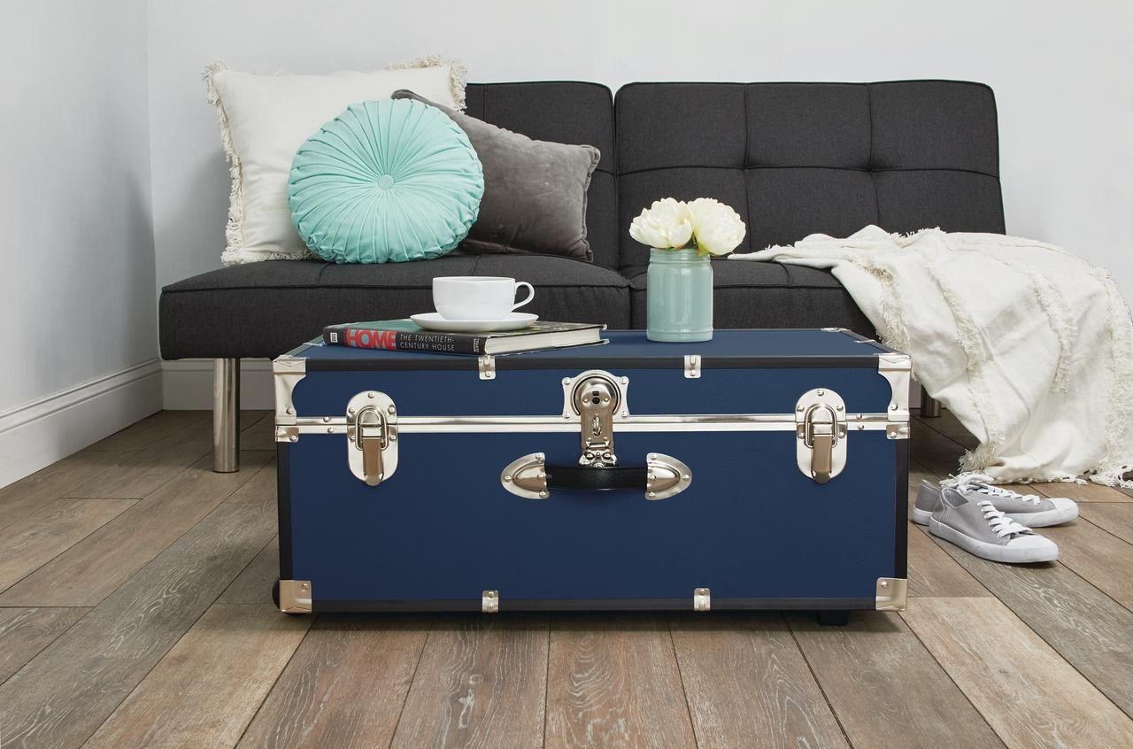 navy blue trunk used as a table in living room 
