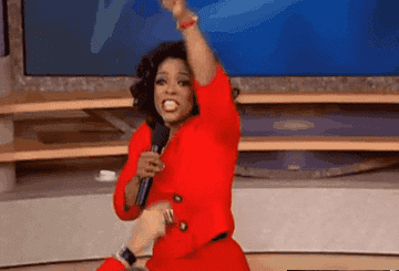Oprah pointing to various people in the audience of her talk show 