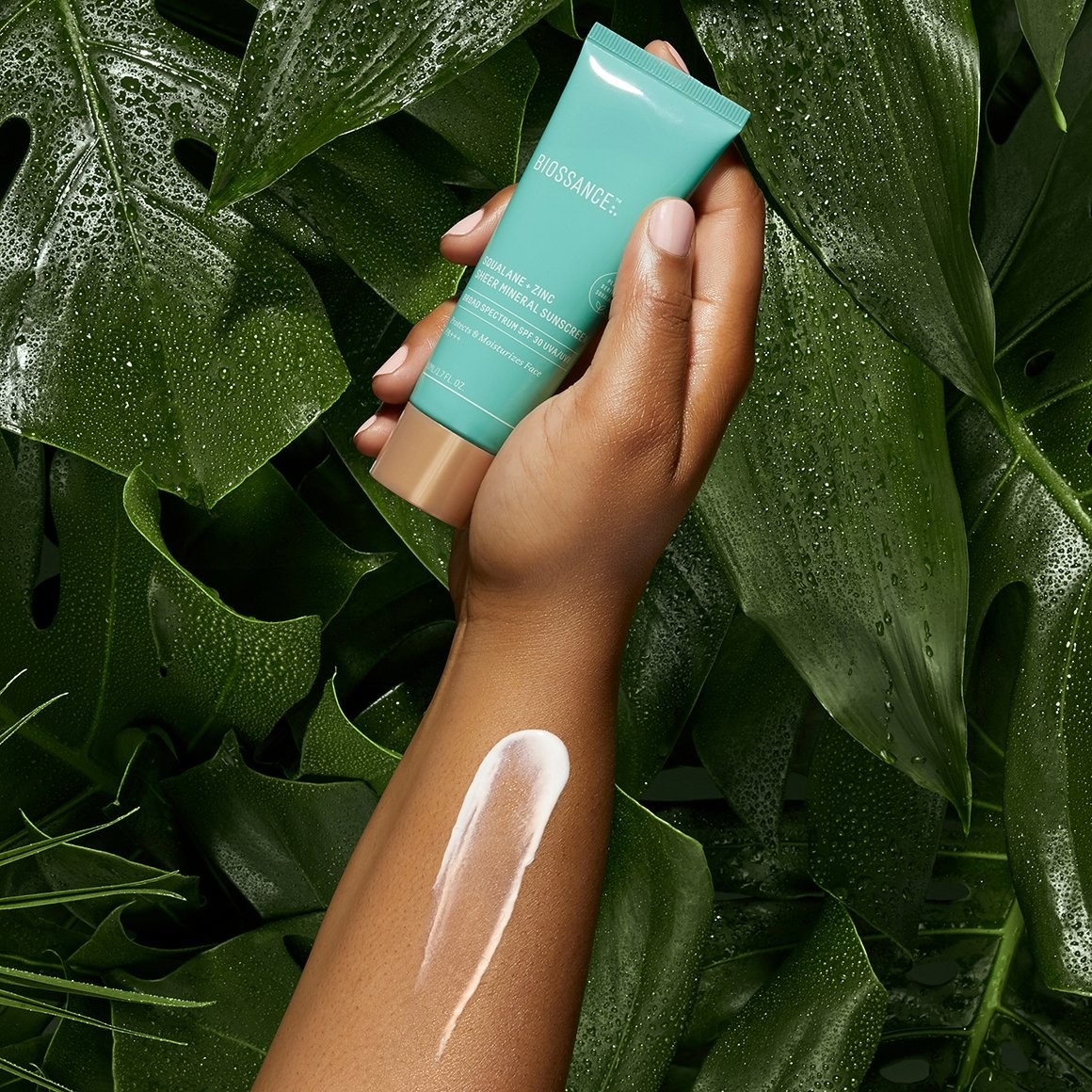 the tube, with the sunscreen swatched on an arm 
