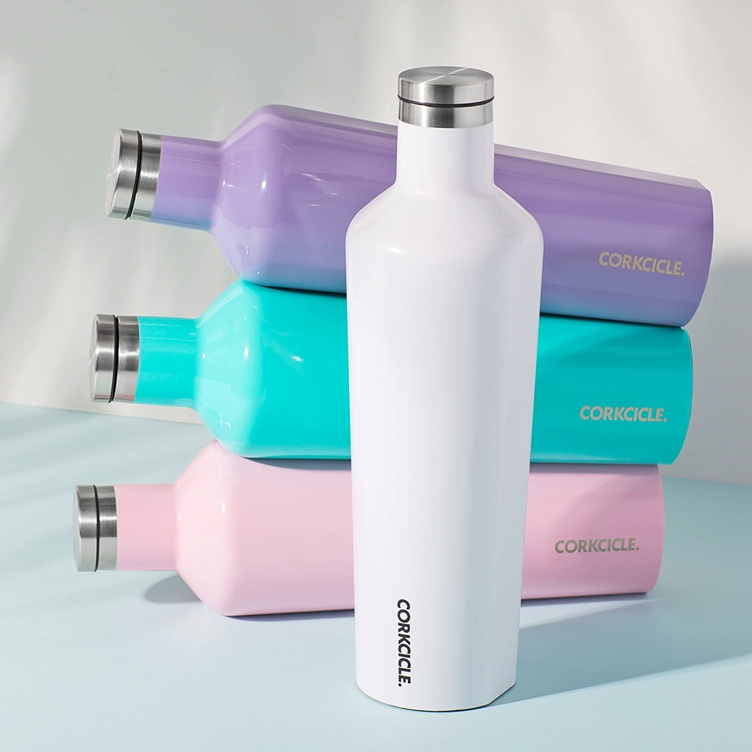 the bottle in white, pink, blue, and purple 