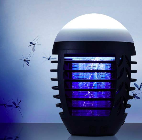 A rounded lamp top with protective barriers around the electric bug-zapping interior 