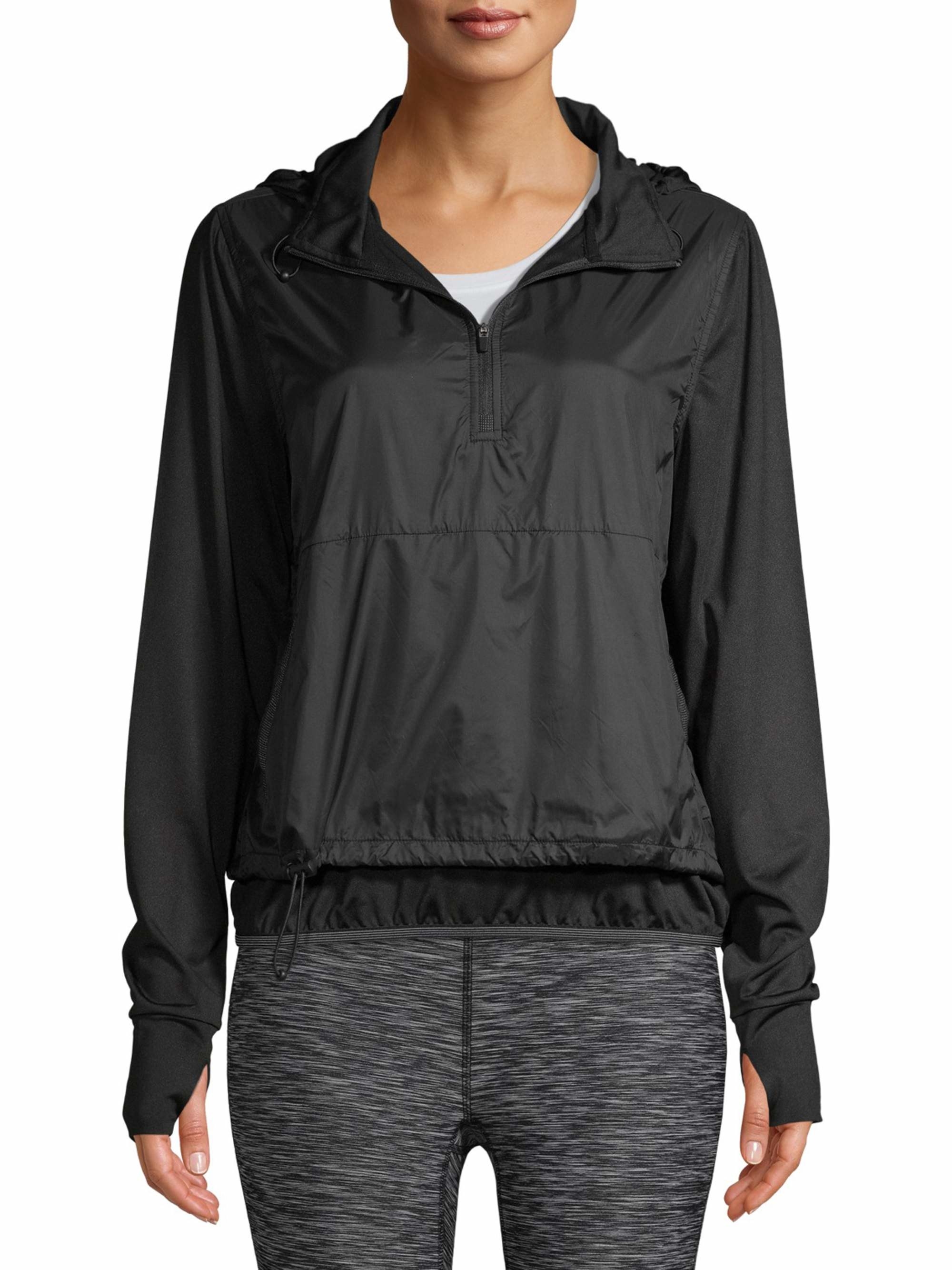 model in a black half-zip rain hoodie