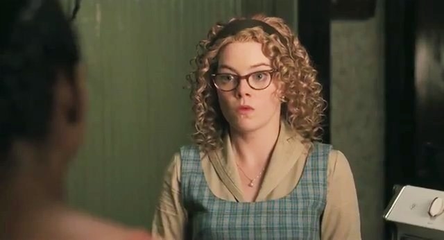 Emma Stone in an obvious curly wig