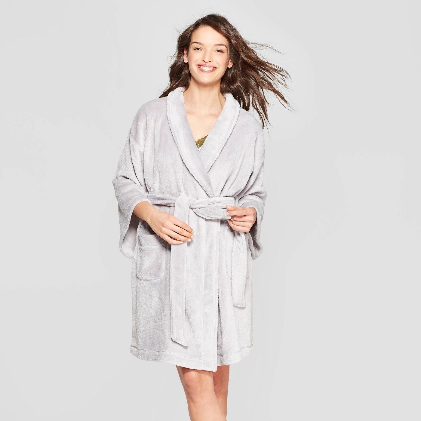 Model wearing gray fleece robe