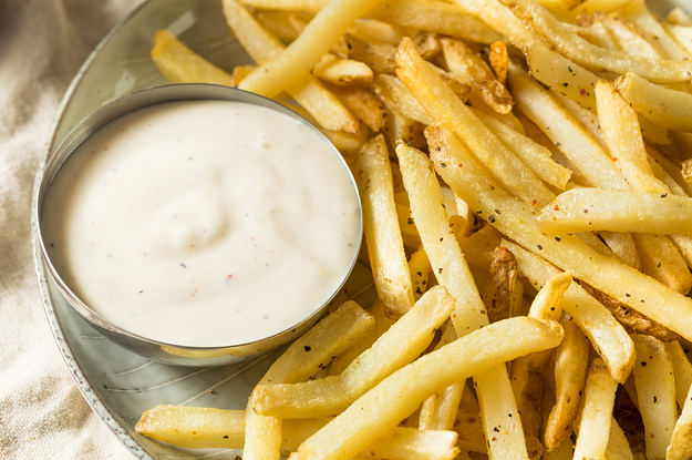 plate of French fries with a side of ranch dressing
