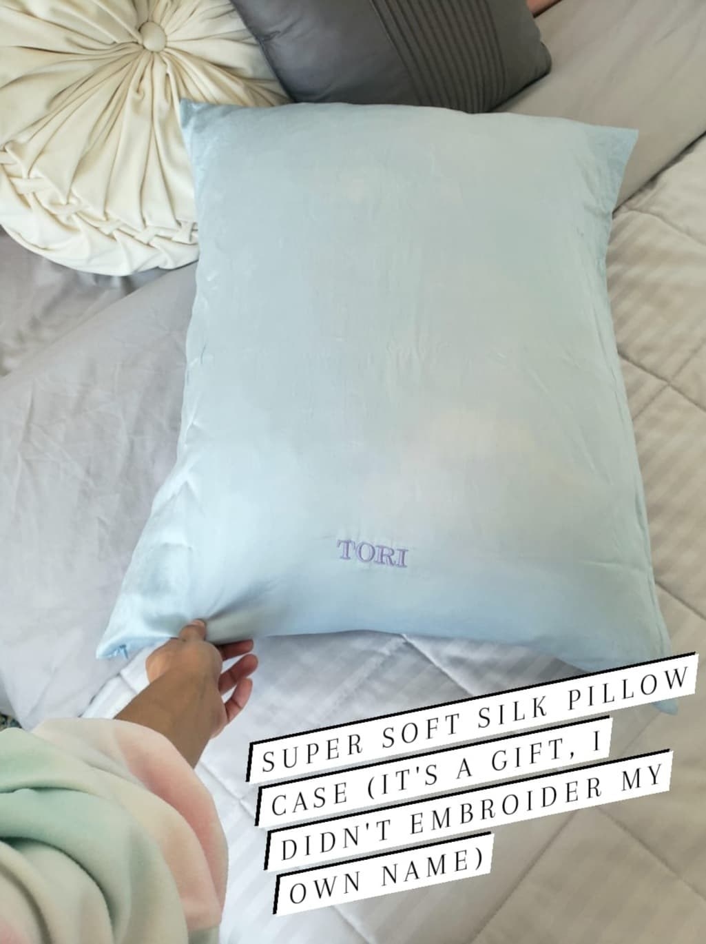The writer&#x27;s silk pillowcase with the caption, &quot;Super soft silk pillow case (it&#x27;s a gift, I didn&#x27;t embroider my own name)&quot;