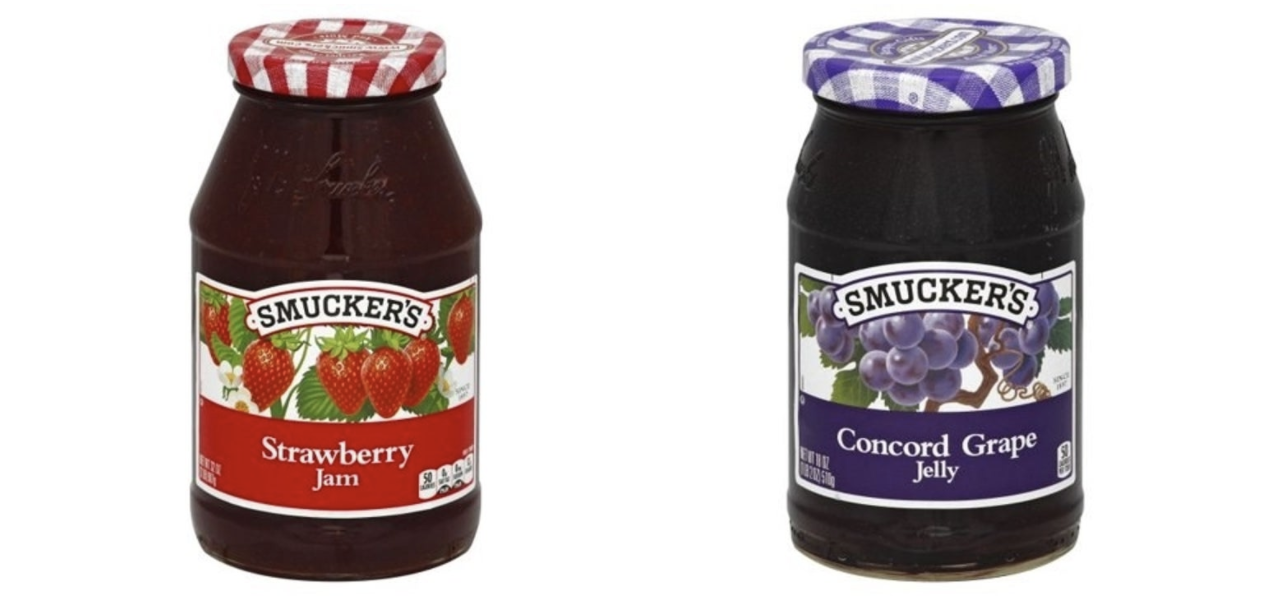 A jar of jam next to a jar of jelly
