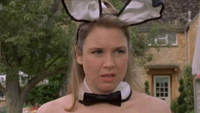 Bridget Jones looking highly embarrassed at a regular party she accidentally went to dressed as a Playboy bunny