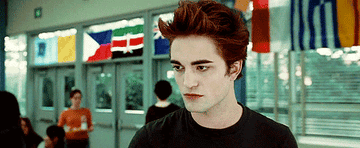 GIF of Robert Pattinson as Edward Cullen in his entrance scene from Twilight