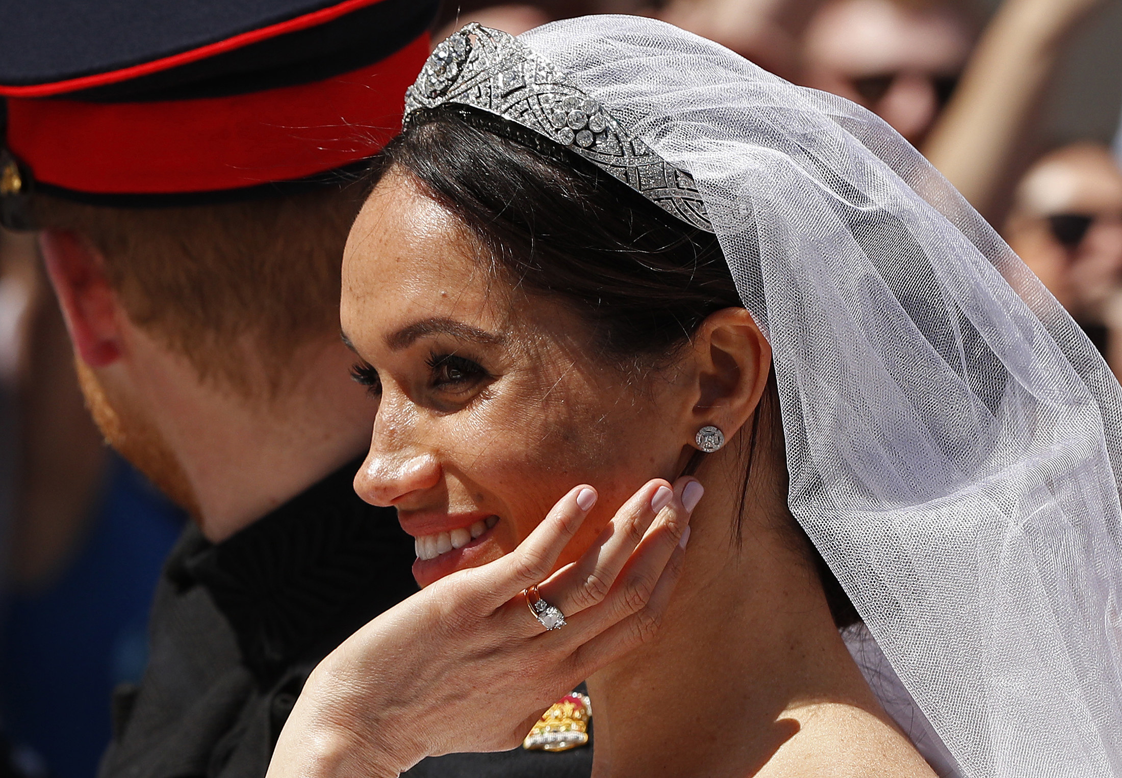 A close up of the Duchess of Sussex, showing her tiara, and engagement ring.