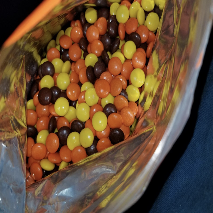 Opened bag of Reese's Pieces candy