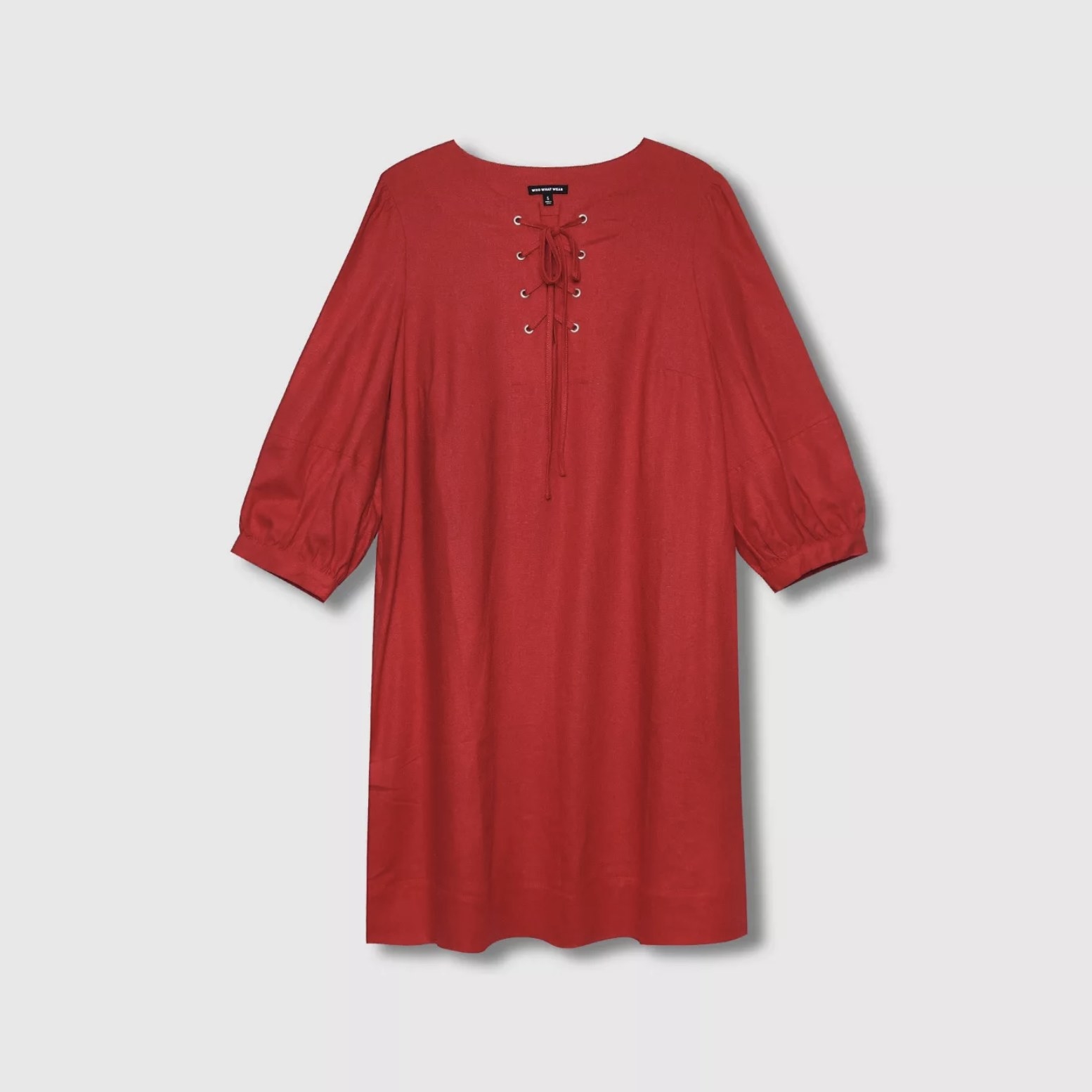 An image of a red dress with three-quarter sleeves and a lace-up design on the neckline