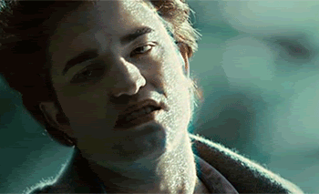 Edward making a face while his skin sparkles.