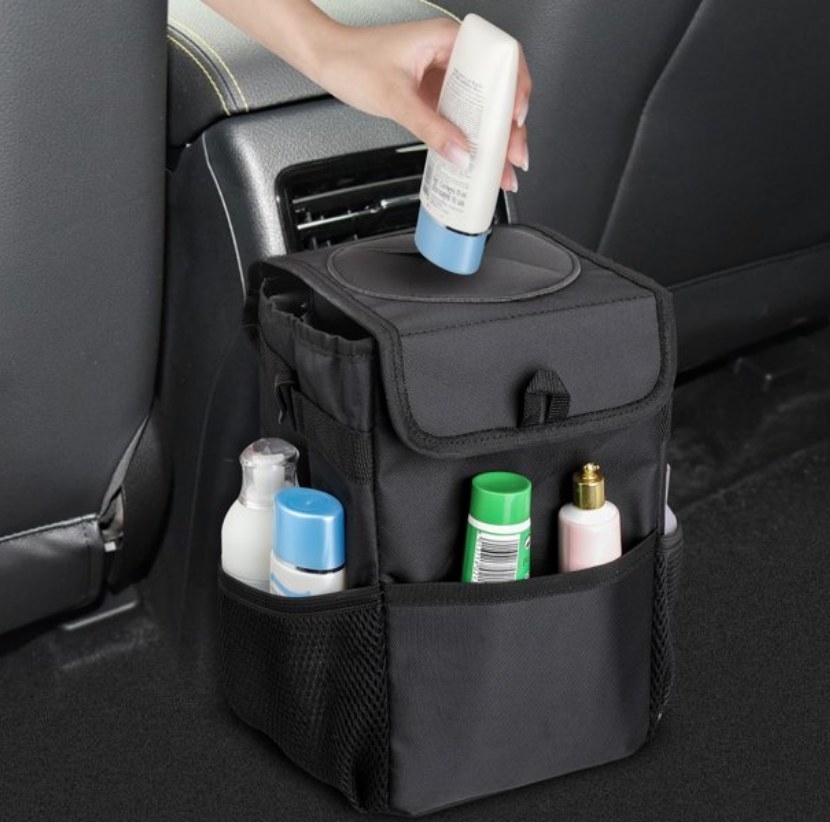 A black car organizer with multiple side pockets and a lid top