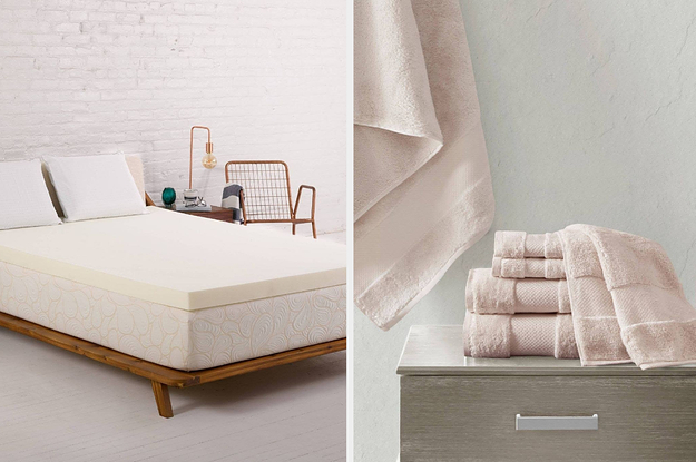 On the left, white mattress topper on a white mattress. On the right, a pile of soft pink towels on a gray table
