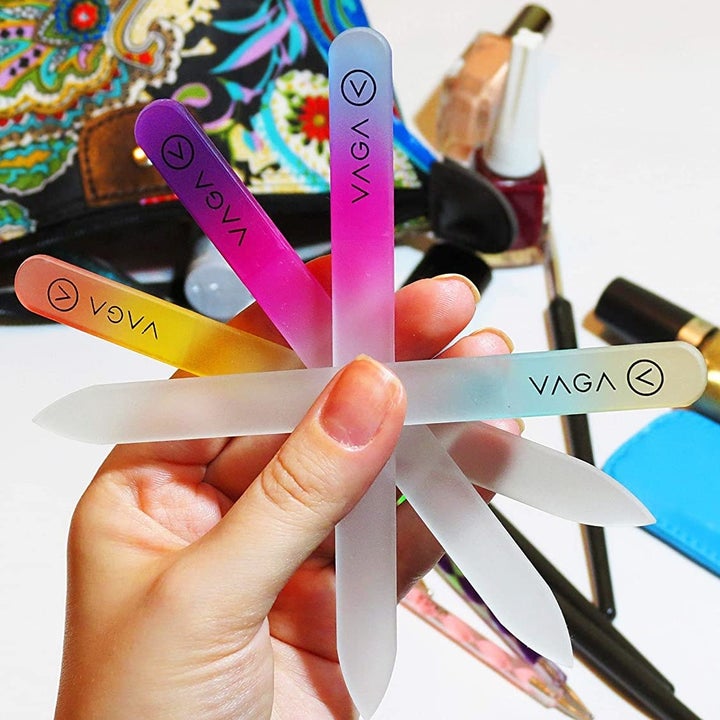 A person holds the crystal files neatly fanned out