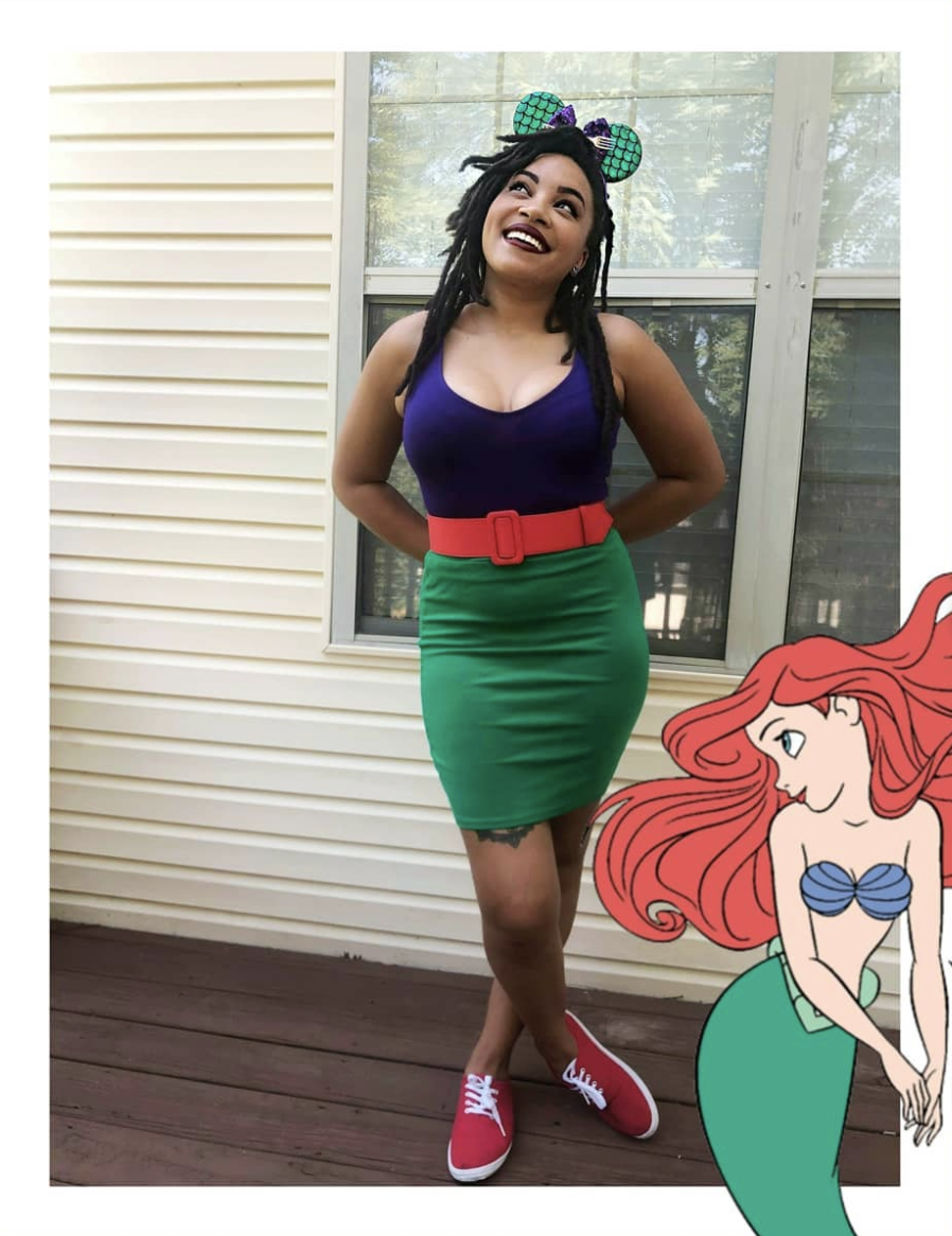 A woman poses and smiles upwards, dressed in an outfit inspired by Ariel, the Little Mermaid, whose image appears in the bottom right corner