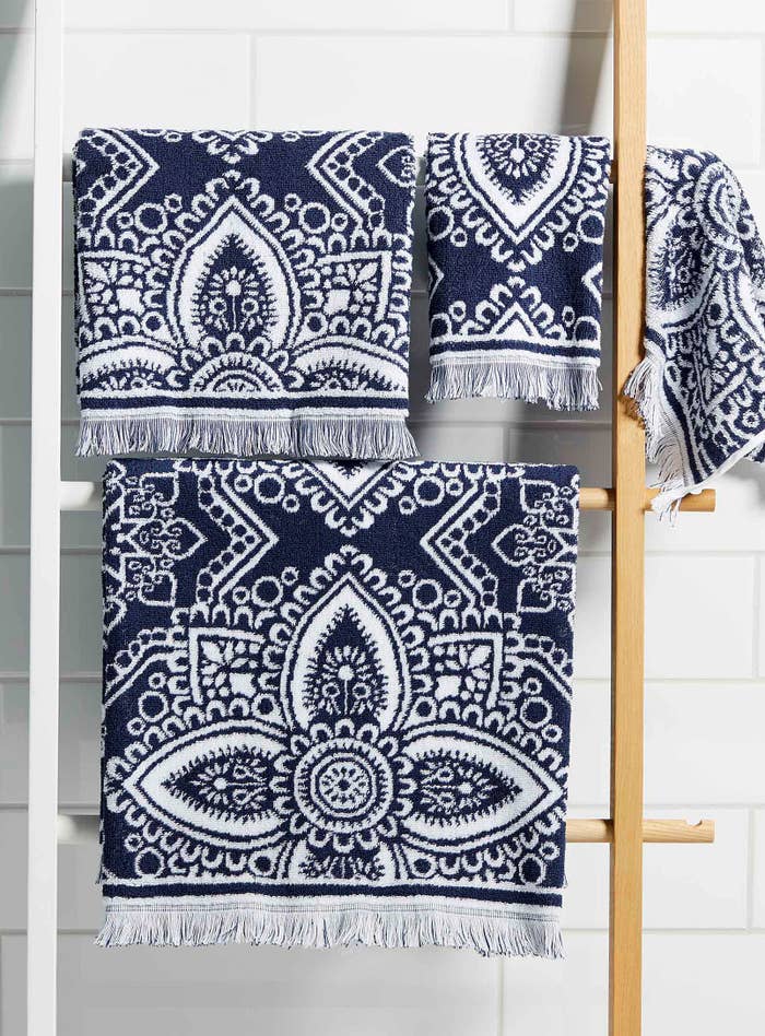 A pattern towel hanging on a wooden rack