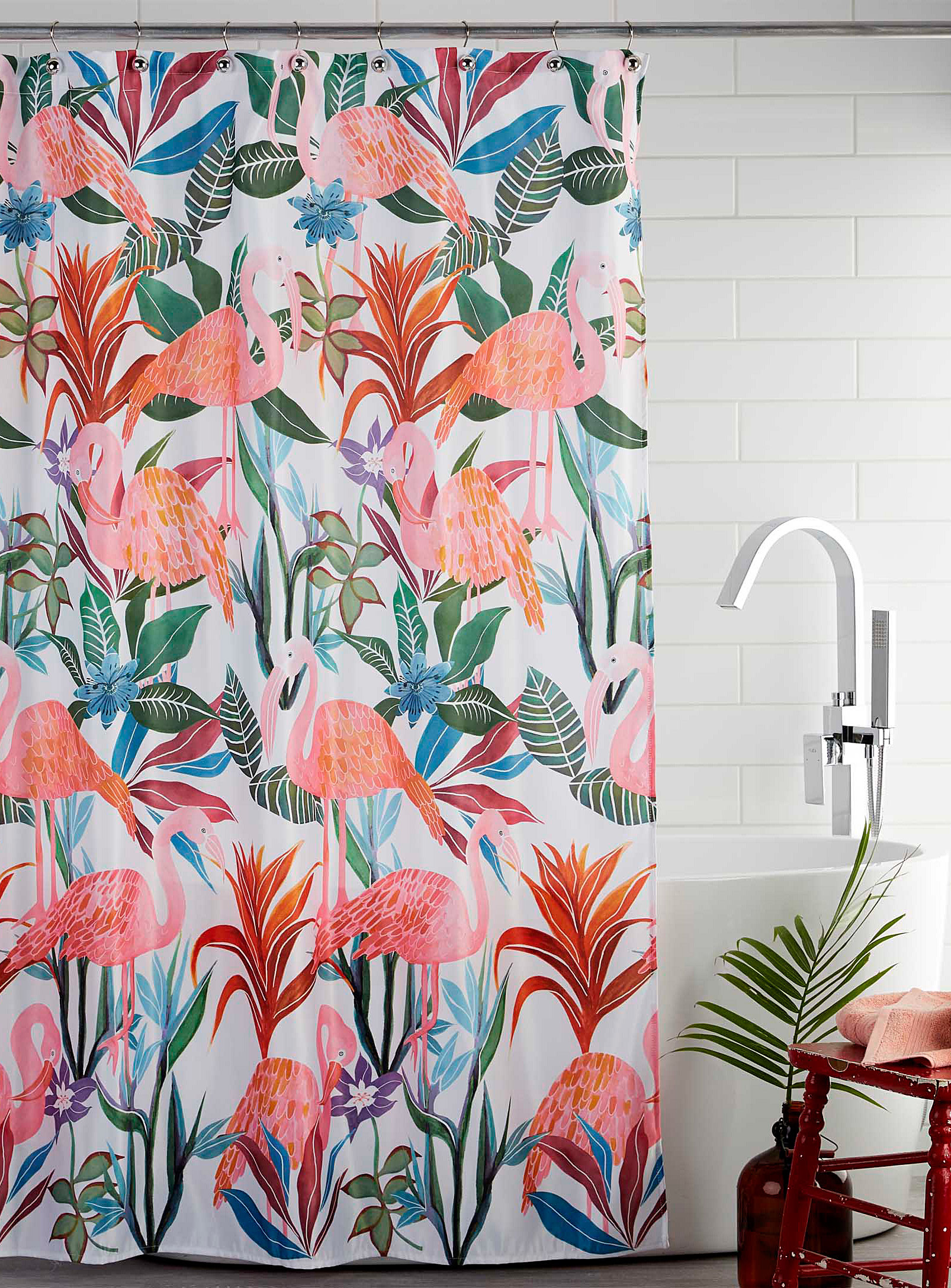 A shower curtain with flamingos printed on it