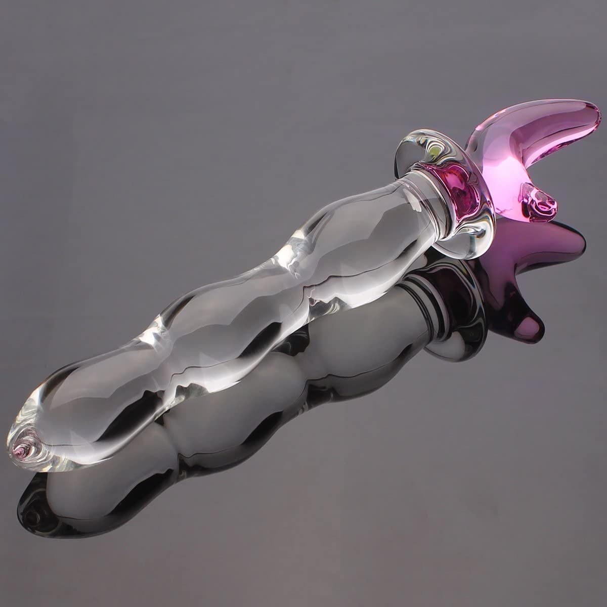 Clear glass dildo with moon detail on top 