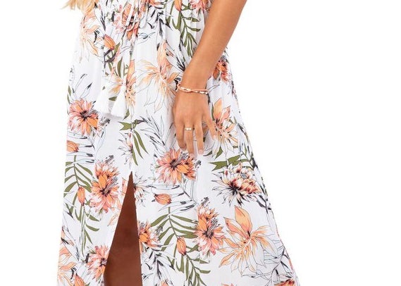 A floral dress with thin straps that gives a sweet and tropical vibe