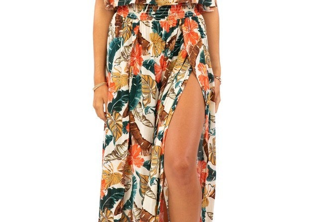 A beachy strapless dress that features a bold and tropical floral pattern