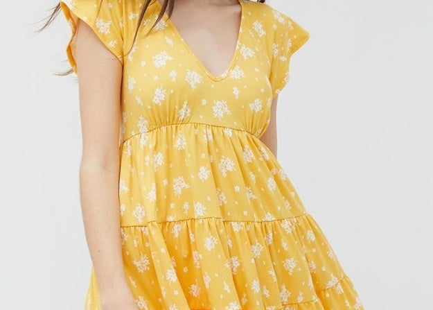 A sweet and casual floral dress that has a flowy skirt and flowy short sleeves