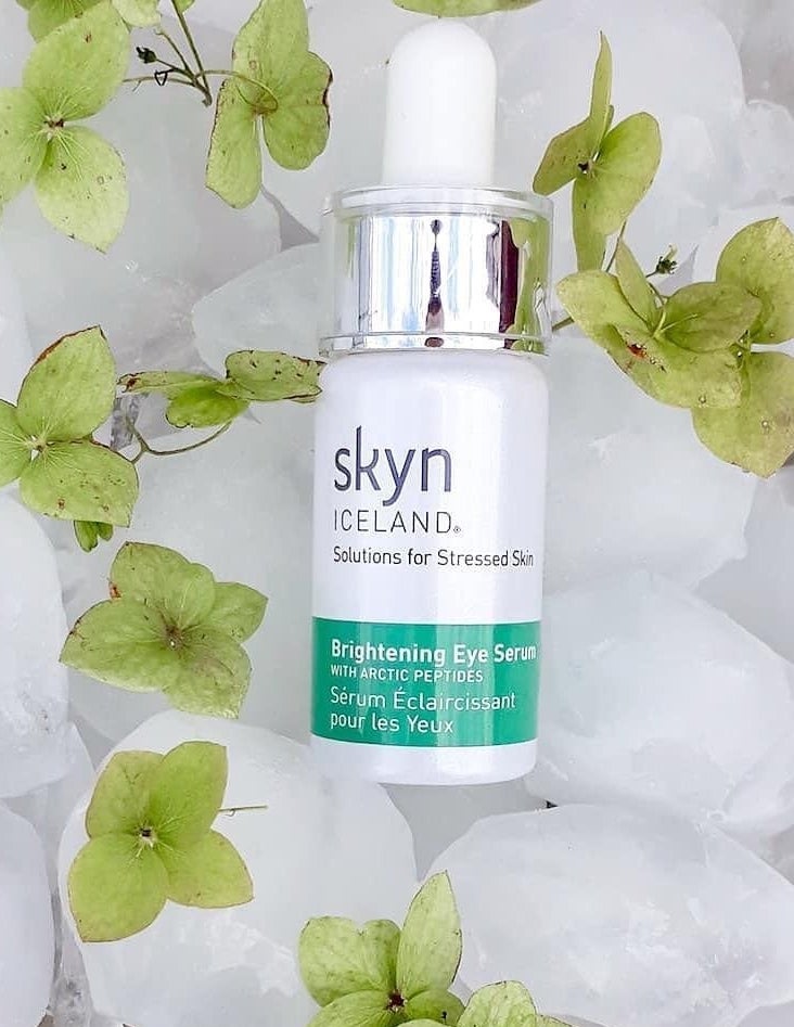 Skyn Iceland&#x27;s Brightening Eye Serum with Arctic peptides modeled over ice cubes