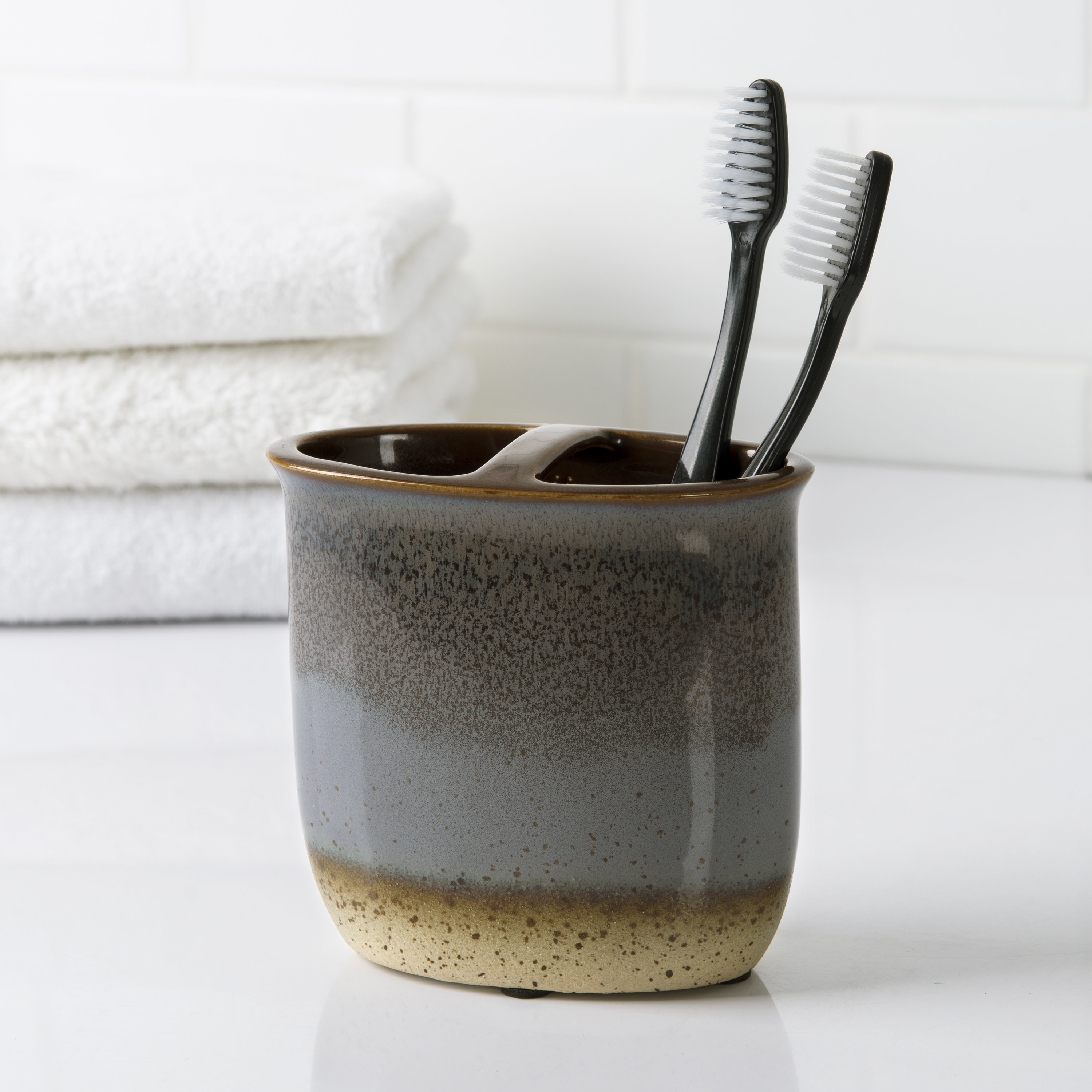 The ceramic toothbrush holder with two large openings 