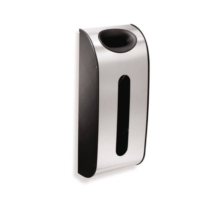 A silver and black wall-mounted plastic bag dispenser