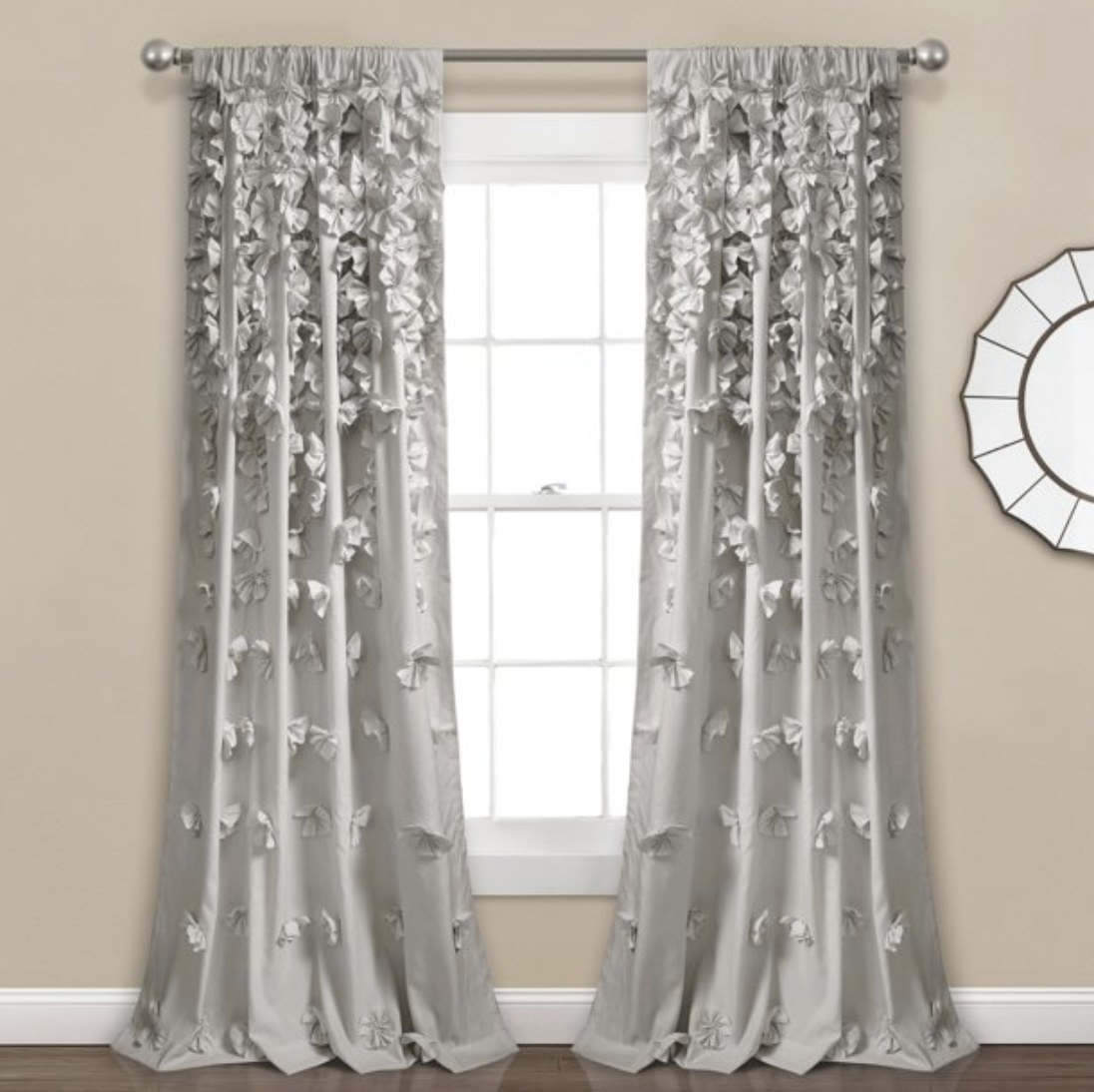The grey curtains with 3D floral designs 