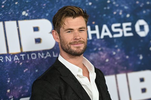 Chris Hemsworth smiles at the premiere for Men in Black International