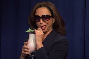 Maya Rudolph sipping a drink as Kamala Harris on 