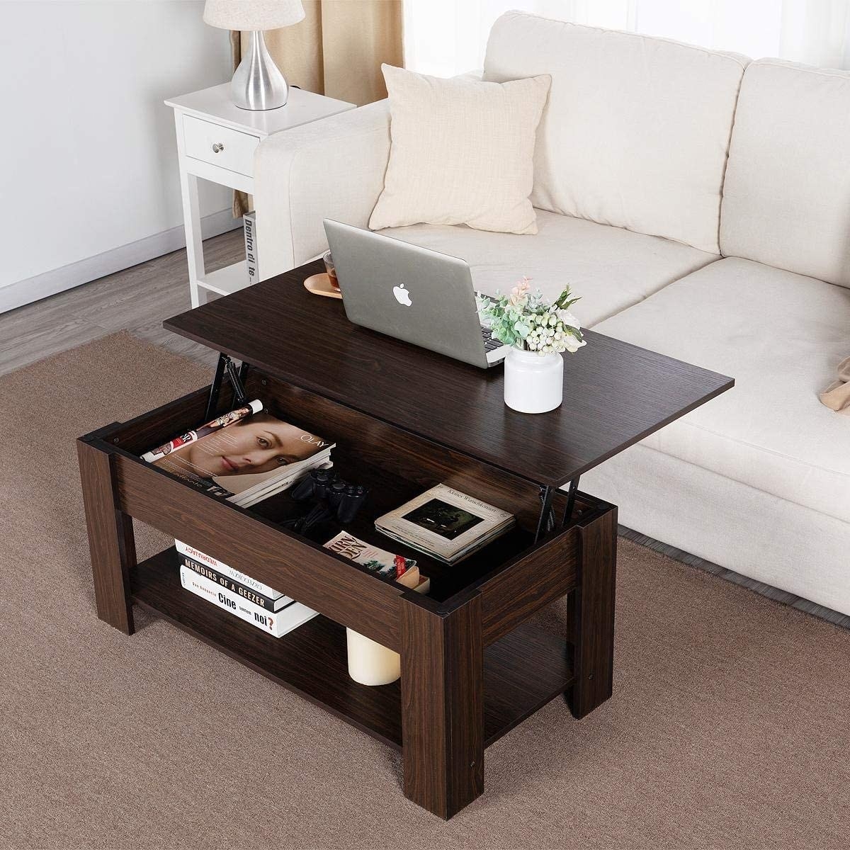 Brown wood coffee table with bottom shelf and a lifting top, revealing an inner area to store more things