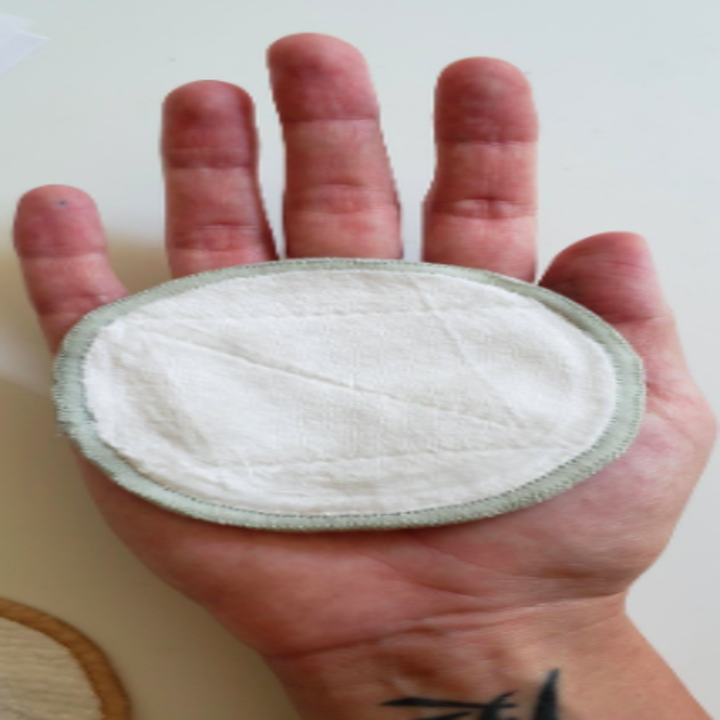 Reviewer photo showing the size of the reusable makeup remover pad on their palm. They're 75mm in diameter, so about the size of the palm of your hand