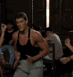 A GIF of Jean-Claude van Damme from Kickboxer showing off his dance moves