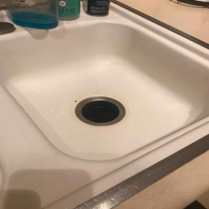 Reviewer photo showing their kitchen sink after using Hope's Perfect Sink Cleaner, revealing the stains and scratches are no longer visible