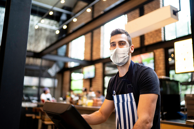 A server wearing a mask