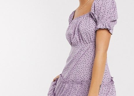 A cute polka dot dress that features short puff sleeves