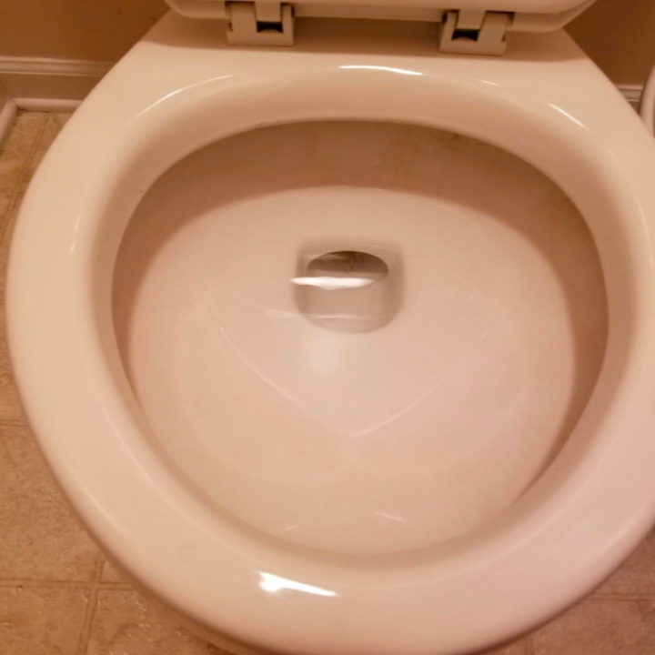 Reviewer photo showing toilet is spotless and clean after using Pumie Toilet Bowl Cleaner. No stains are visible at all