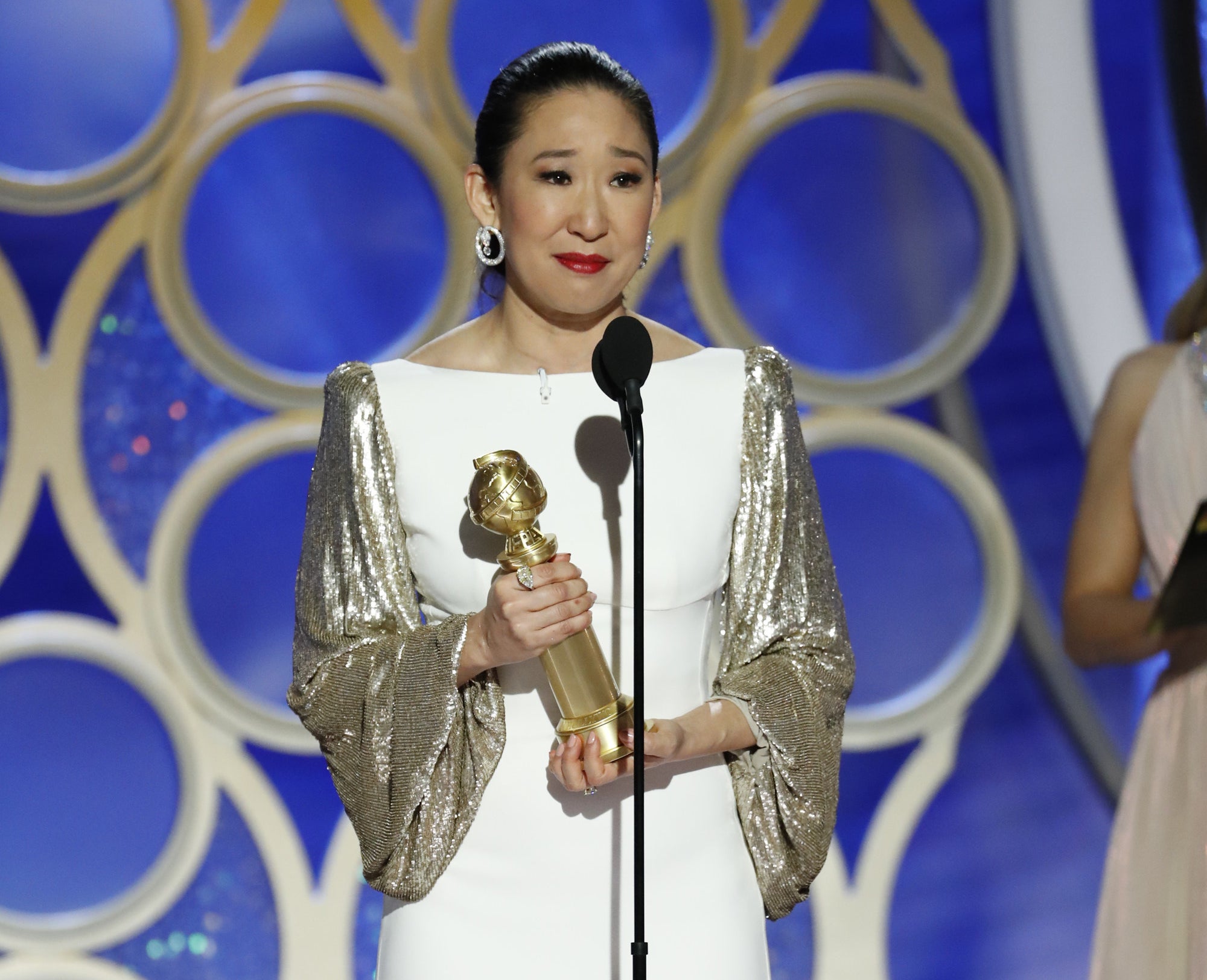 Sandra Oh on stage accepting her Golden Globe Award for Best Actress in a Drama Series for "Killing Eve"