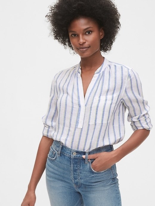 model wearing white and blue striped button up shirt