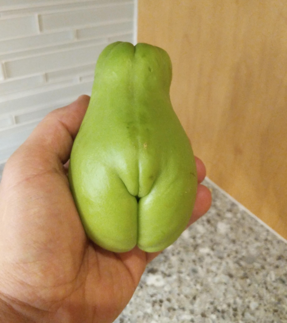 A pear that looks like it has legs and a vulva