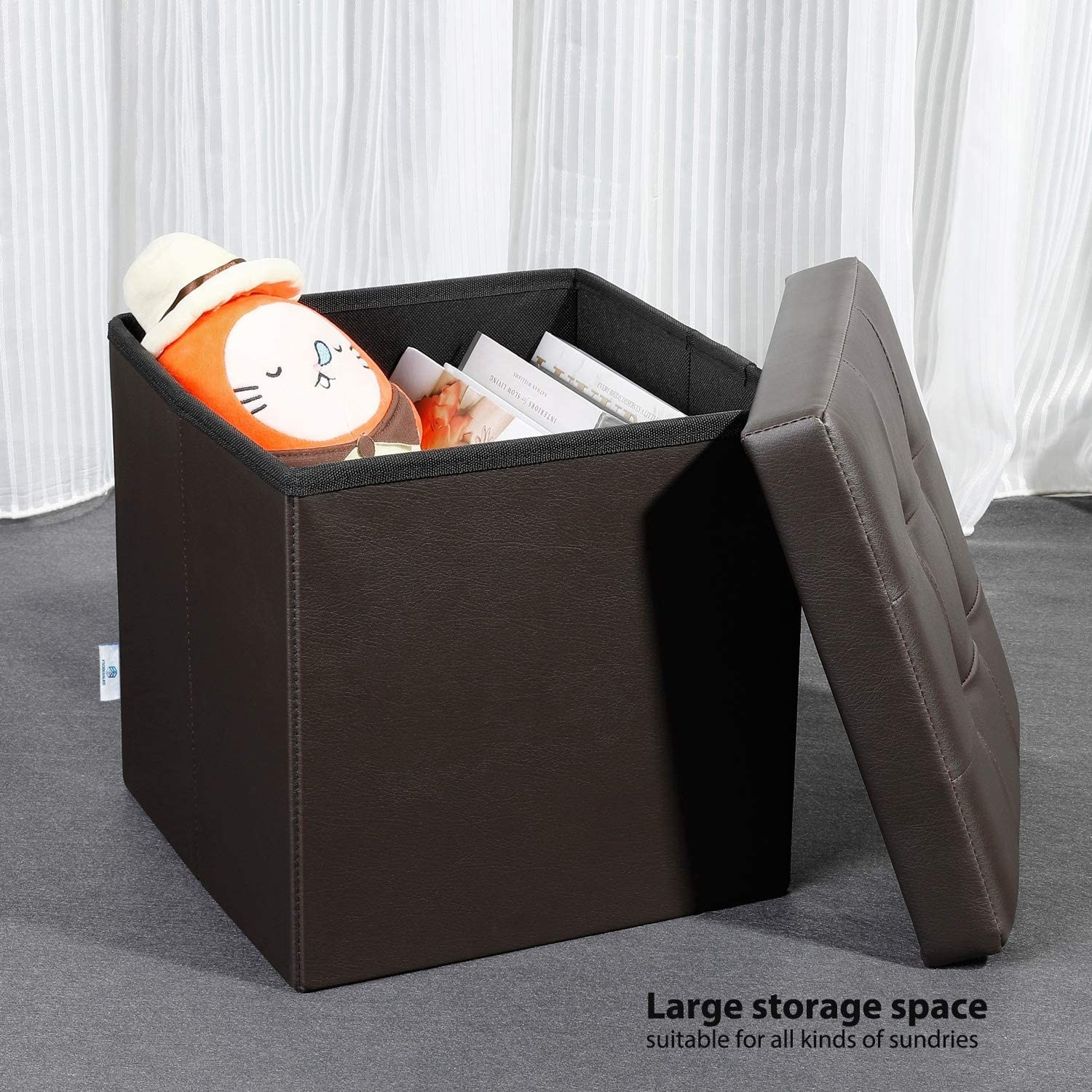 The storage ottoman in brown.